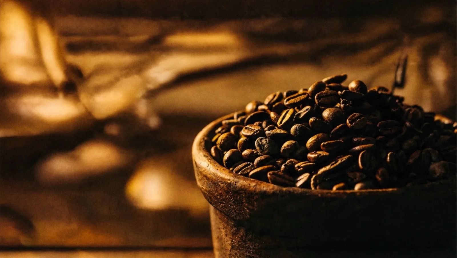 Roasted coffee beans in a clay bowl